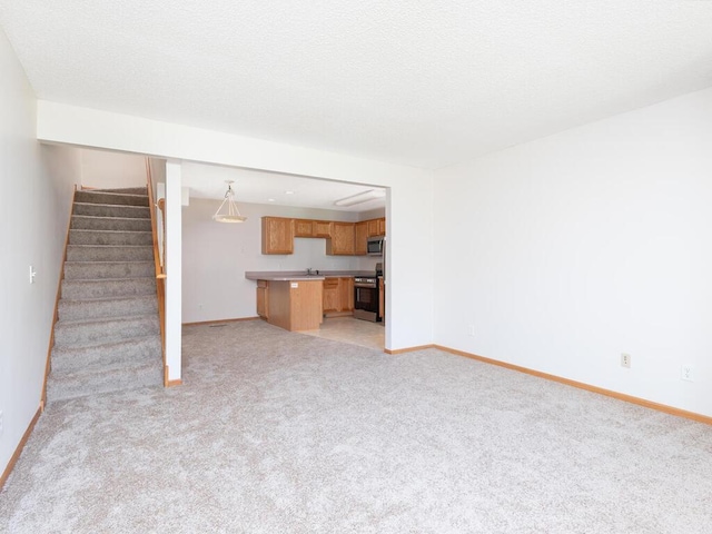 2248 Affirmed Dr, Shakopee, MN 55379 - unfurnished living room with light colored carpet and stairs