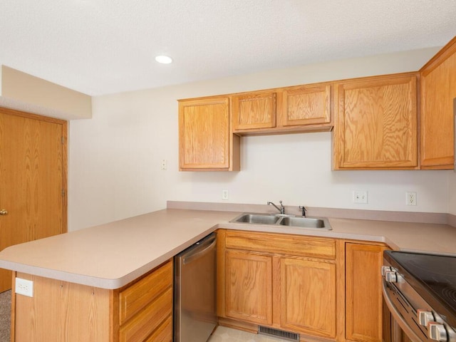 2248 Affirmed Dr, Shakopee, MN 55379 - kitchen featuring appliances with stainless steel finishes, light countertops, a peninsula, and recessed lighting