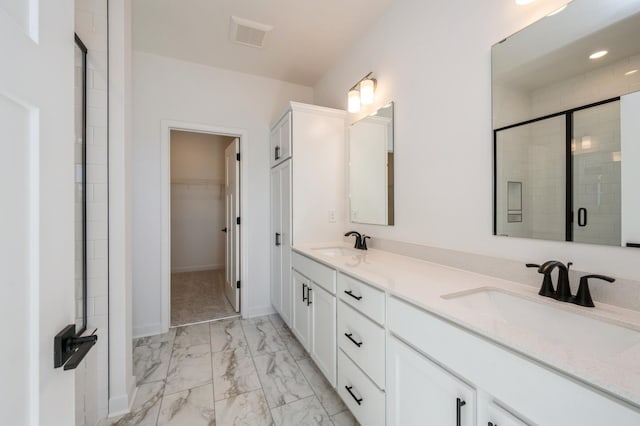 9755 49th St NE, Saint Michael, MN 55376 - bathroom featuring marble look tiles, double vanity, a shower stall, and a walk in closet