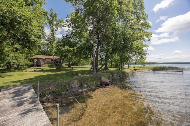 551 Edward Ln NE, Longville, MN 56655 - dock area featuring a water view and a lawn