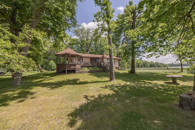 551 Edward Ln NE, Longville, MN 56655 - view of green lawn with a wooden deck