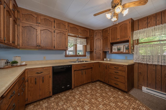 551 Edward Ln NE, Longville, MN 56655 - kitchen with dishwasher, a baseboard heating unit, a ceiling fan, brown cabinetry, and light countertops