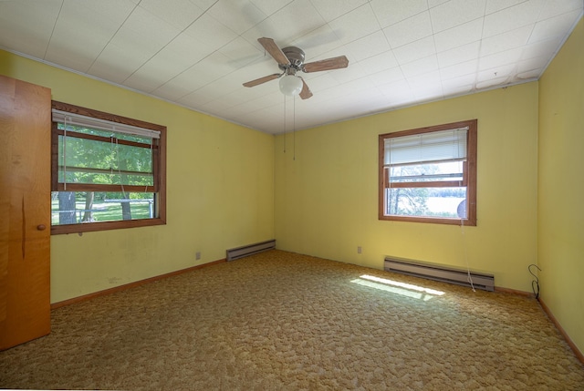 551 Edward Ln NE, Longville, MN 56655 - carpeted spare room featuring a baseboard radiator, healthy amount of natural light, and a ceiling fan