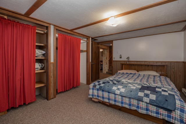 551 Edward Ln NE, Longville, MN 56655 - carpeted bedroom featuring a textured ceiling, wainscoting, and wood walls