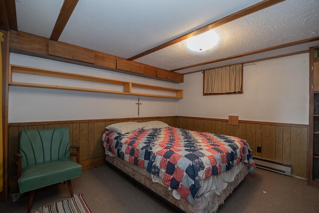 551 Edward Ln NE, Longville, MN 56655 - carpeted bedroom with baseboard heating, a wainscoted wall, wooden walls, and a textured ceiling