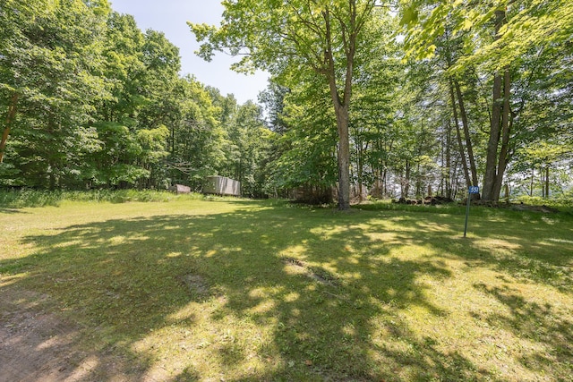 551 Edward Ln NE, Longville, MN 56655 - view of green lawn featuring a view of trees and an outdoor structure