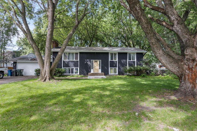 10048 Upton Rd, Bloomington, MN 55431 - split foyer home with asphalt driveway, a front yard, and a chimney