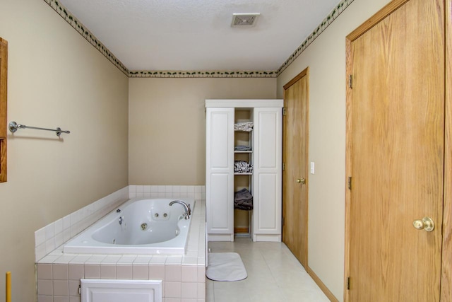 427 Alleghany Ave, Wabasha, MN 55981 - bathroom featuring a jetted tub and tile patterned flooring