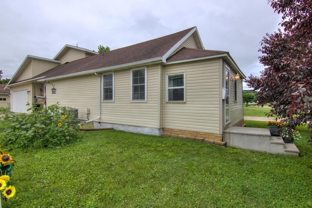 427 Alleghany Ave, Wabasha, MN 55981 - view of property exterior with a lawn, an attached garage, and a shingled roof
