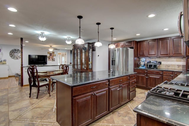 427 Alleghany Ave, Wabasha, MN 55981 - kitchen with stainless steel fridge, recessed lighting, decorative backsplash, a center island, and pendant lighting