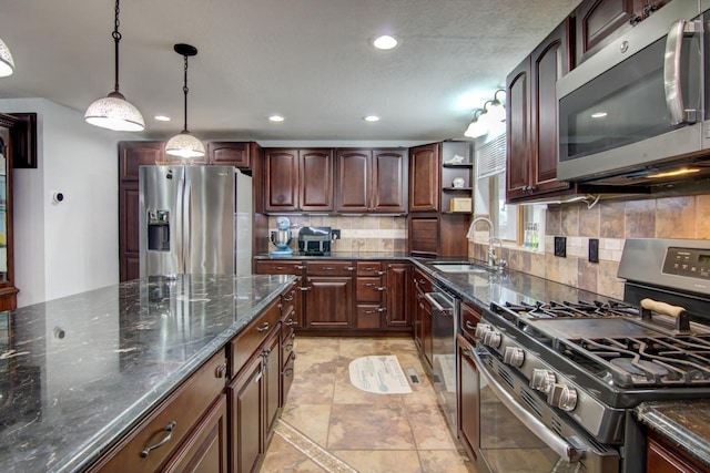 427 Alleghany Ave, Wabasha, MN 55981 - kitchen featuring stainless steel appliances, decorative backsplash, dark stone countertops, decorative light fixtures, and recessed lighting