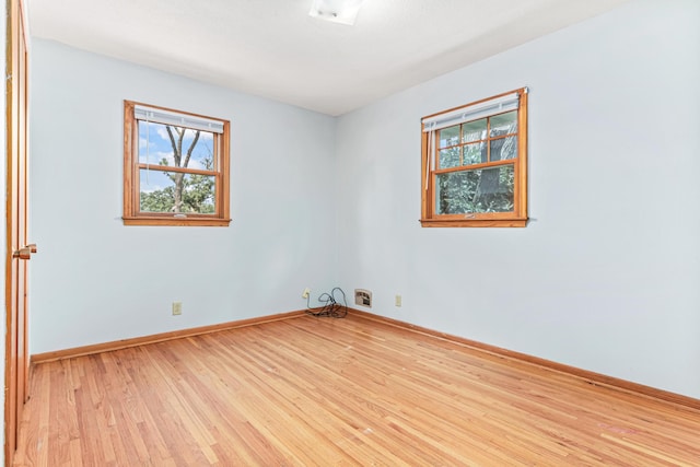 1920 108th Ln NW, Coon Rapids, MN 55433 - spare room featuring healthy amount of natural light and light wood-style floors