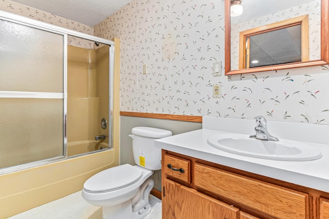 1920 108th Ln NW, Coon Rapids, MN 55433 - full bath with wallpapered walls, vanity, a textured ceiling, and bath / shower combo with glass door
