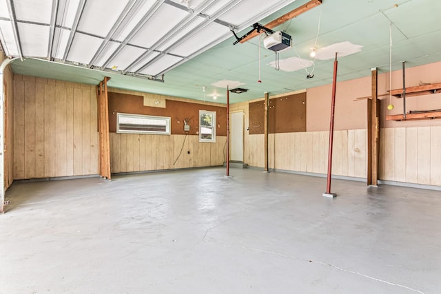 1920 108th Ln NW, Coon Rapids, MN 55433 - garage with a garage door opener and wood walls