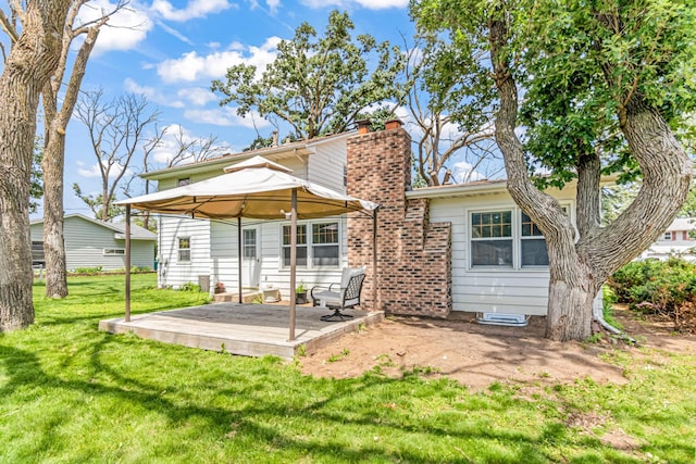 1920 108th Ln NW, Coon Rapids, MN 55433 - rear view of property featuring a chimney, a lawn, and a wooden deck