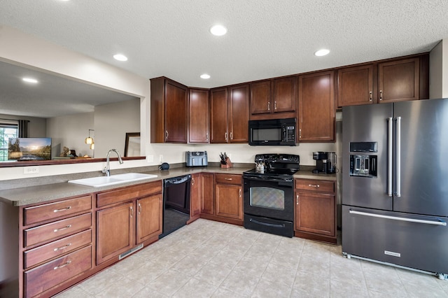 5062 French Dr N, Hugo, MN 55038 - kitchen with black appliances, recessed lighting, a textured ceiling, a peninsula, and light tile patterned floors