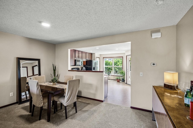 5062 French Dr N, Hugo, MN 55038 - dining space with light carpet, a textured ceiling, and recessed lighting