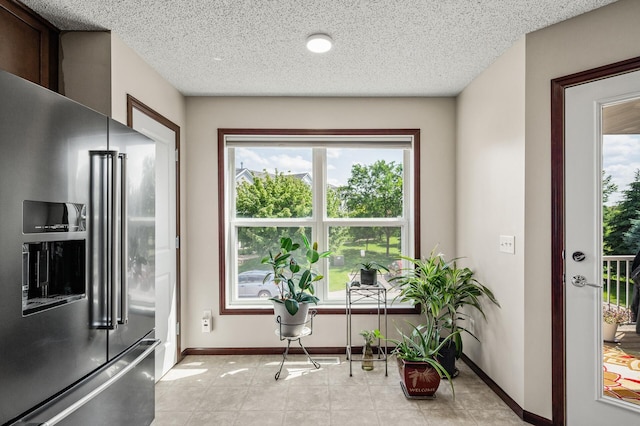 5062 French Dr N, Hugo, MN 55038 - kitchen featuring high end refrigerator and a textured ceiling