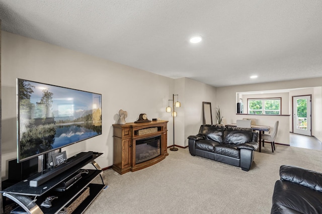 5062 French Dr N, Hugo, MN 55038 - living room with carpet flooring, a glass covered fireplace, and recessed lighting