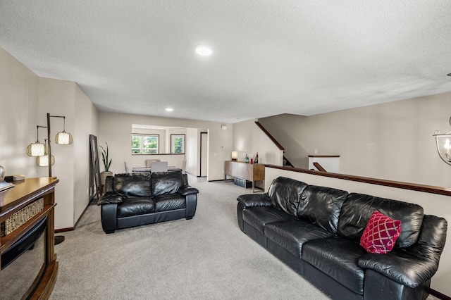 5062 French Dr N, Hugo, MN 55038 - living area with carpet floors, a textured ceiling, and recessed lighting