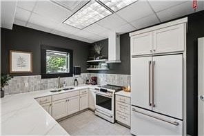 5062 French Dr N, Hugo, MN 55038 - kitchen with white appliances, a drop ceiling, white cabinetry, light stone counters, and open shelves