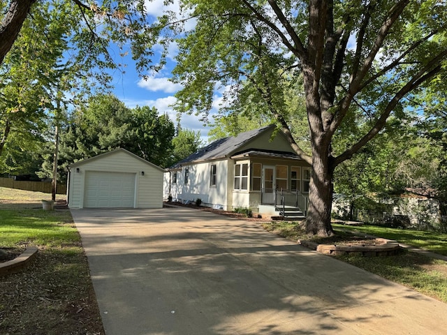 6821 225th Ln N, Stacy, MN 55079 - view of front of home featuring a garage, driveway, an outdoor structure, and covered porch