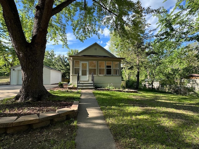 6821 225th Ln N, Stacy, MN 55079 - view of front facade with a front lawn, an outbuilding, and a garage