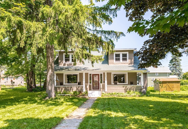 4223 Mcculloch St, Duluth, MN 55804 - view of front facade with a front lawn, a storage unit, and a shingled roof