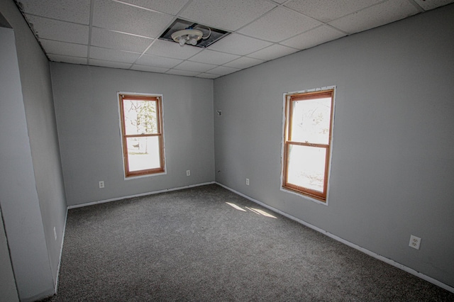 608 Lake St, Osakis, MN 56360 - unfurnished room featuring carpet floors and a paneled ceiling