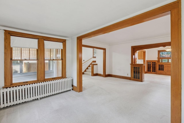 2085 Princeton Ave, Saint Paul, MN 55105 - carpeted spare room featuring radiator and stairway