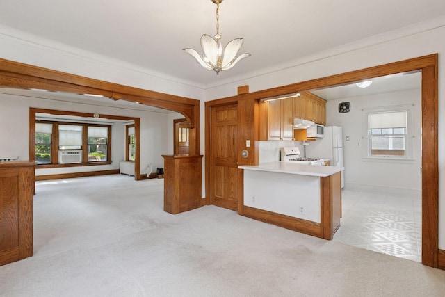 2085 Princeton Ave, Saint Paul, MN 55105 - kitchen featuring a chandelier, range with gas cooktop, light carpet, and light countertops