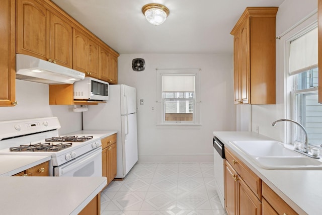2085 Princeton Ave, Saint Paul, MN 55105 - kitchen with white appliances, under cabinet range hood, light flooring, and healthy amount of natural light