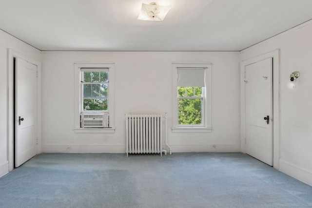 2085 Princeton Ave, Saint Paul, MN 55105 - carpeted spare room featuring radiator, plenty of natural light, and cooling unit