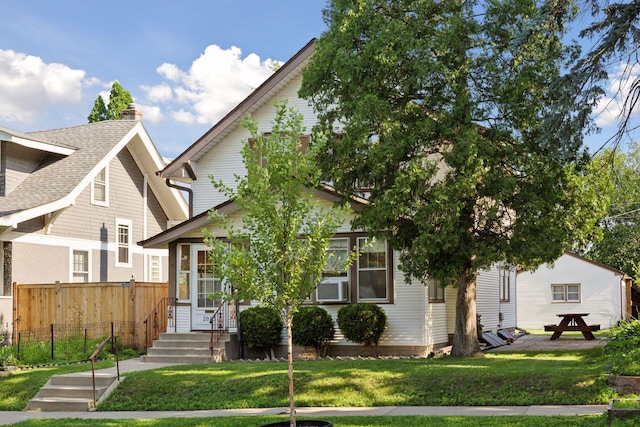 2085 Princeton Ave, Saint Paul, MN 55105 - view of front of home with roof with shingles, a chimney, and cooling unit