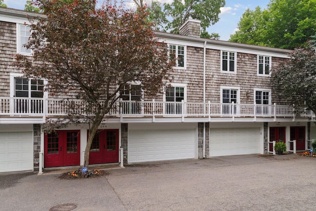 204 Central Ave S, Wayzata, MN 55391 - view of property with a chimney and a garage