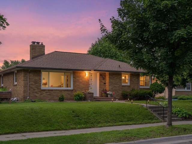 910 62nd St, Minneapolis, MN 55419 - single story home with brick siding, a yard, a chimney, and roof with shingles