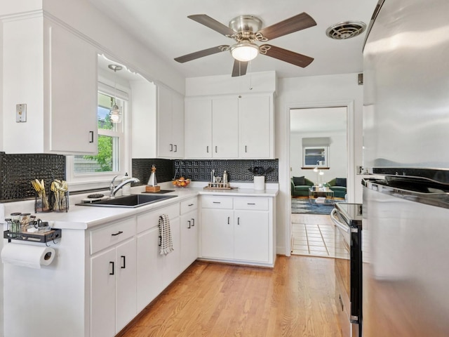 910 62nd St, Minneapolis, MN 55419 - kitchen with stainless steel appliances, light countertops, tasteful backsplash, and ceiling fan