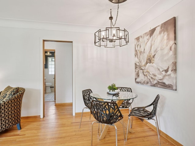 910 62nd St, Minneapolis, MN 55419 - dining space featuring a chandelier and light wood-style flooring