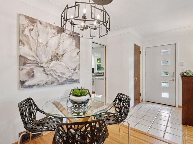 910 62nd St, Minneapolis, MN 55419 - dining area featuring a chandelier and light tile patterned floors