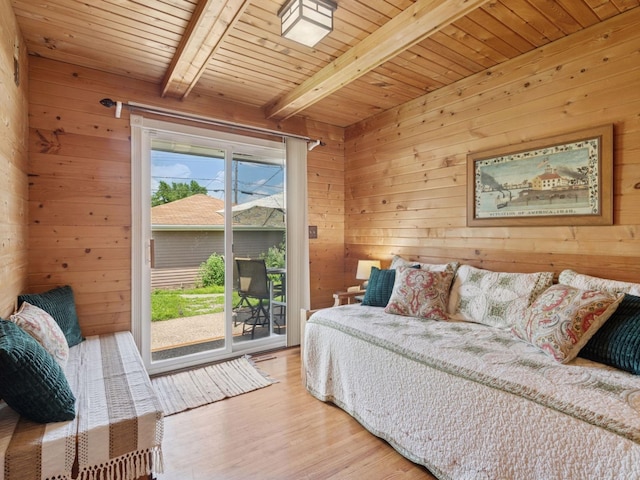 910 62nd St, Minneapolis, MN 55419 - bedroom with wood walls, access to exterior, wood finished floors, and a wood ceiling with exposed beams