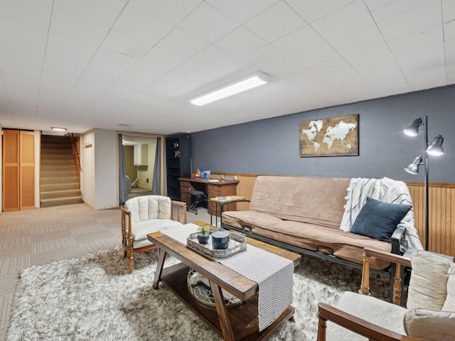 910 62nd St, Minneapolis, MN 55419 - carpeted living room featuring stairway, wainscoting, and wood walls