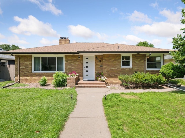910 62nd St, Minneapolis, MN 55419 - ranch-style home featuring brick siding, a front lawn, and a chimney