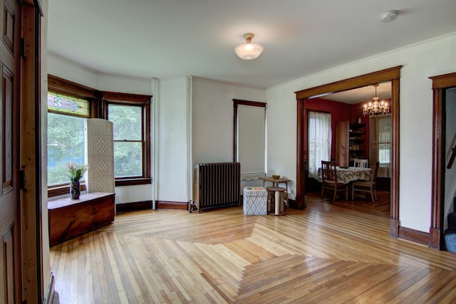 924 6th St W, Wabasha, MN 55981 - foyer featuring radiator heating unit and a chandelier