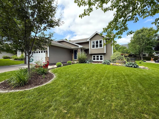 5750 Lone Oak Dr, Savage, MN 55378 - split level home featuring a front lawn, concrete driveway, and a garage