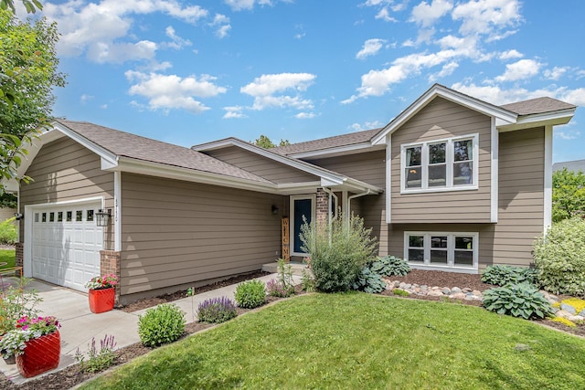 5750 Lone Oak Dr, Savage, MN 55378 - tri-level home with an attached garage, a front yard, driveway, and a shingled roof