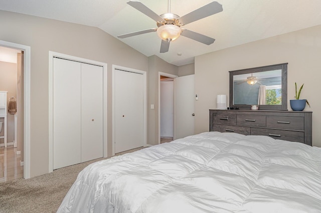 5750 Lone Oak Dr, Savage, MN 55378 - carpeted bedroom with multiple closets, lofted ceiling, and ceiling fan