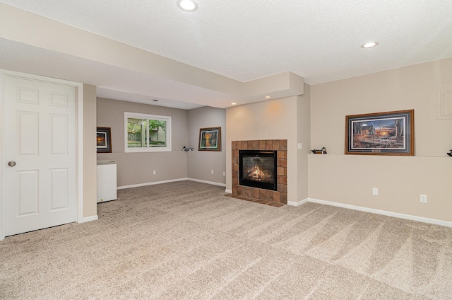 5750 Lone Oak Dr, Savage, MN 55378 - unfurnished living room featuring carpet, a tile fireplace, a textured ceiling, and recessed lighting