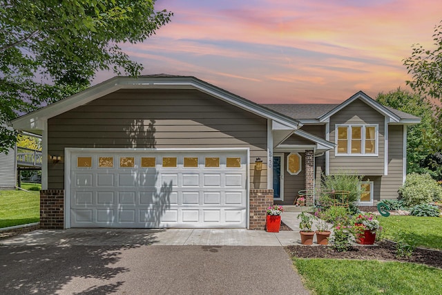 5750 Lone Oak Dr, Savage, MN 55378 - tri-level home featuring driveway and an attached garage