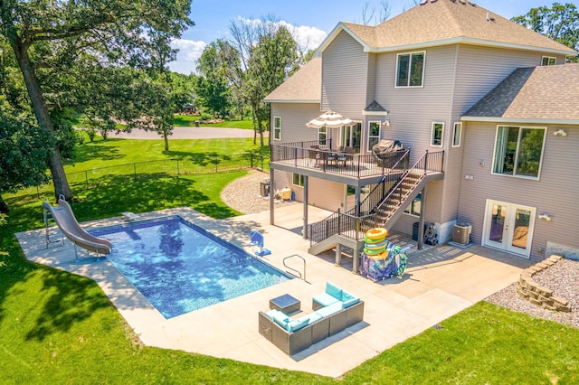 141 145th Ln NE, Ham Lake, MN 55304 - view of pool with stairs, a deck, a patio area, french doors, and a water slide