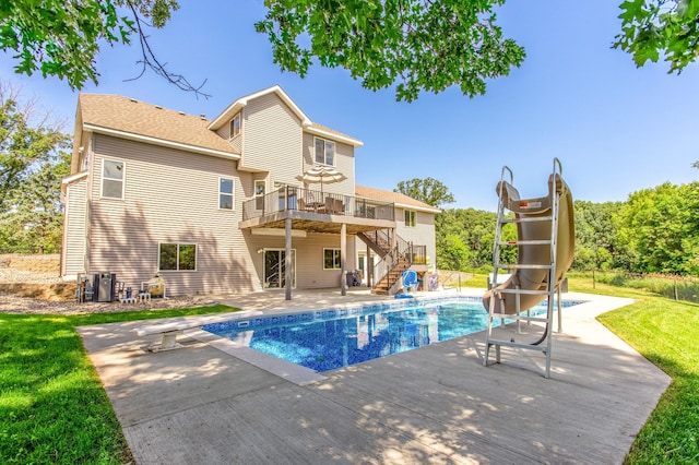 141 145th Ln NE, Ham Lake, MN 55304 - outdoor pool with stairway, a deck, a patio, and a water slide